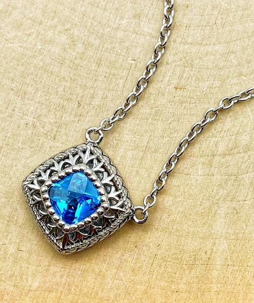 Sterling silver checkerboard cut Swiss blue topaz necklace. $250.00