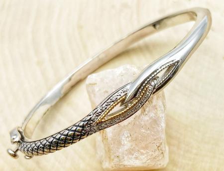 Sterling silver and 18 karat gold diamond bangle bracelet. $350.00