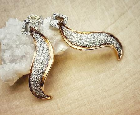 18 karat rose and white gold diamond swirl earrings. $2,950.00
