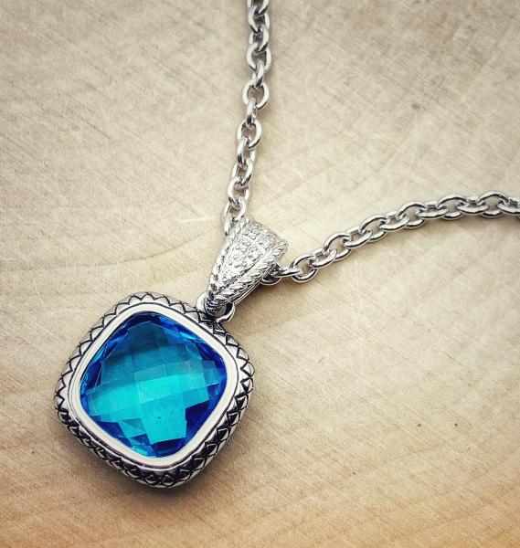 Sterling silver cushion checkerboard cut Swiss blue topaz and diamond necklace. $500.00